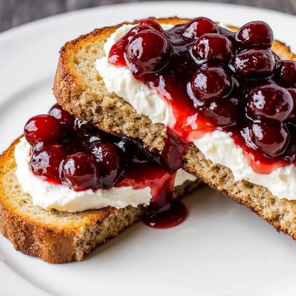 Close-up of cranberry brie crostini showing creamy cheese and cranberry topping.