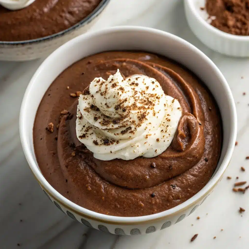 Overhead shot of creamy cottage cheese chocolate mousse in a bowl.