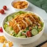 High Protein Spicy McChicken Salad bowl with crispy chicken and creamy dressing.