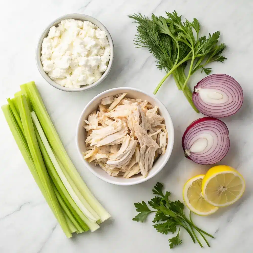 Fresh ingredients for high protein chicken salad including cottage cheese, dill, and rotisserie chicken.