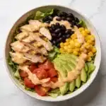 The complete high protein southwest chicken salad ready to eat.