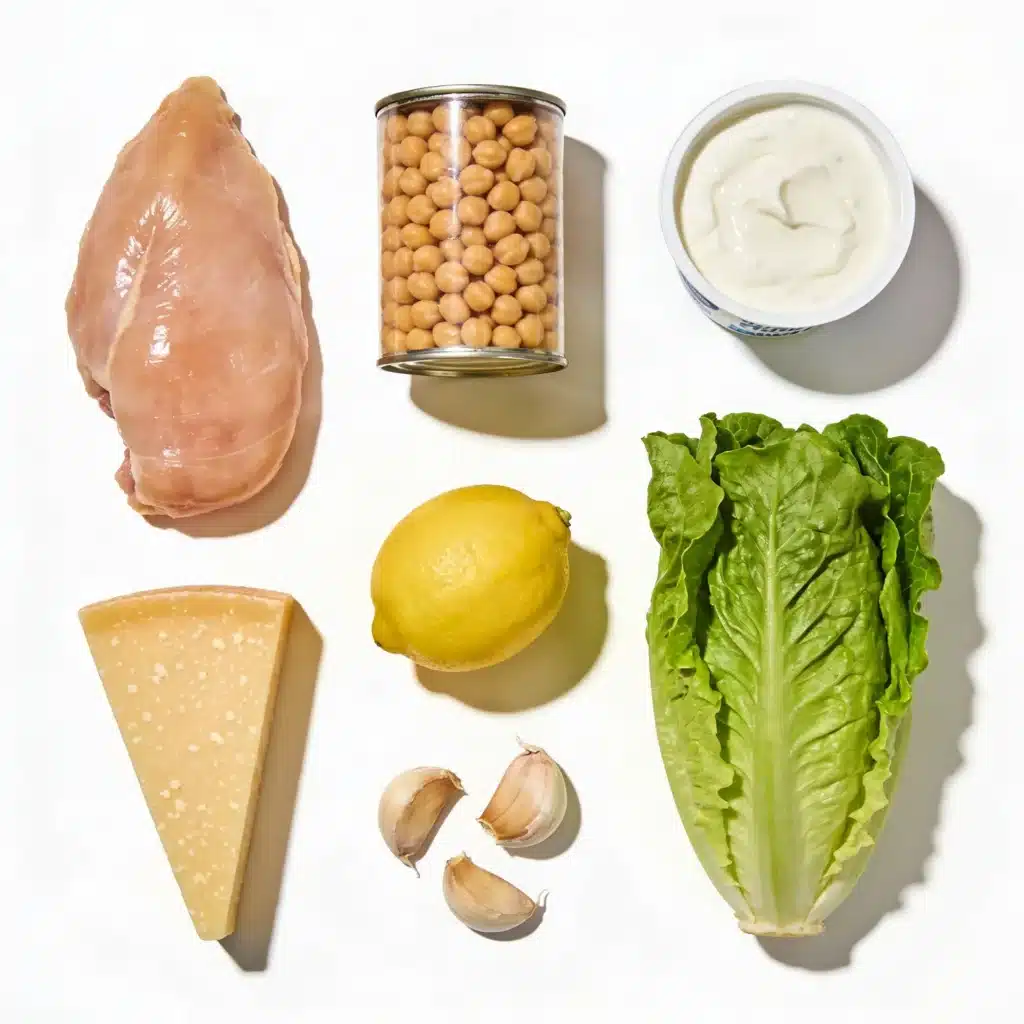 Ingredients for healthy chicken caesar salad including yogurt and chickpeas.