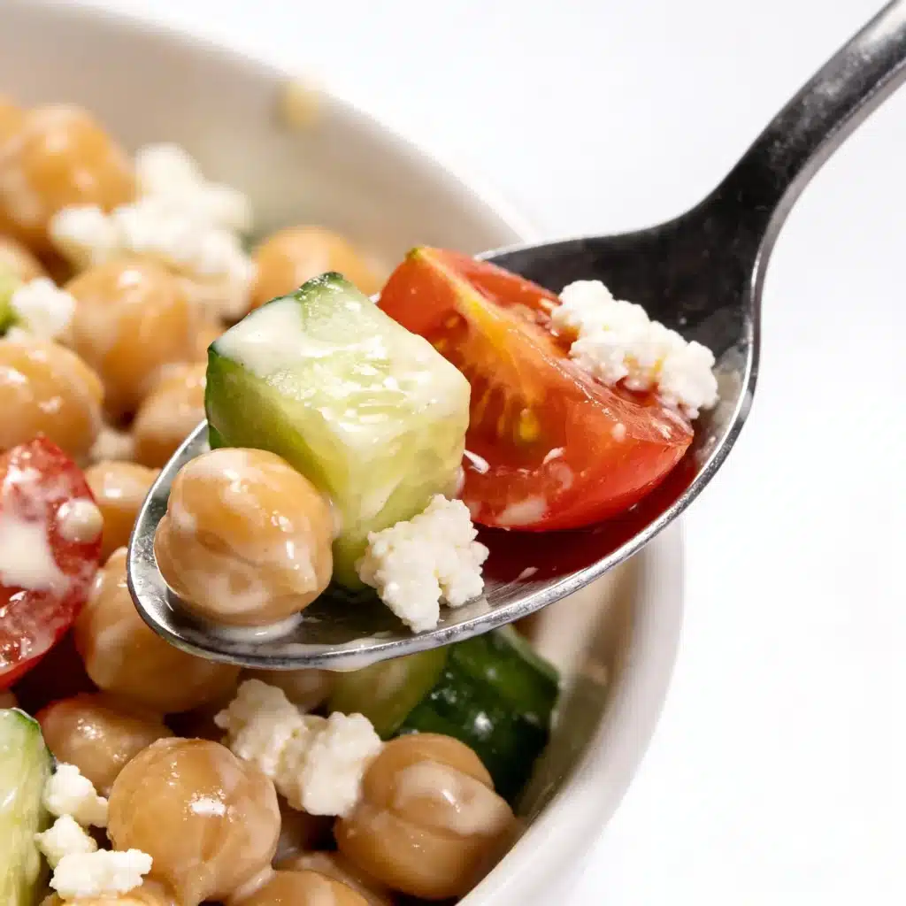 Close up of a spoonful of creamy chickpea salad