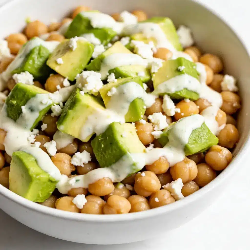 Mediterranean chickpea salad topped with fresh avocado.