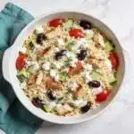 High Protein Greek Orzo Salad with grilled chicken and fresh vegetables.