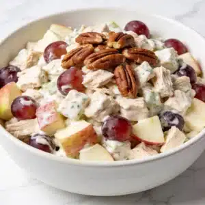 A finished bowl of High Protein Sonoma Chicken Salad featuring grapes and apples.
