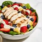 High Protein Strawberry Poppyseed Salad with chicken and poppyseed dressing.