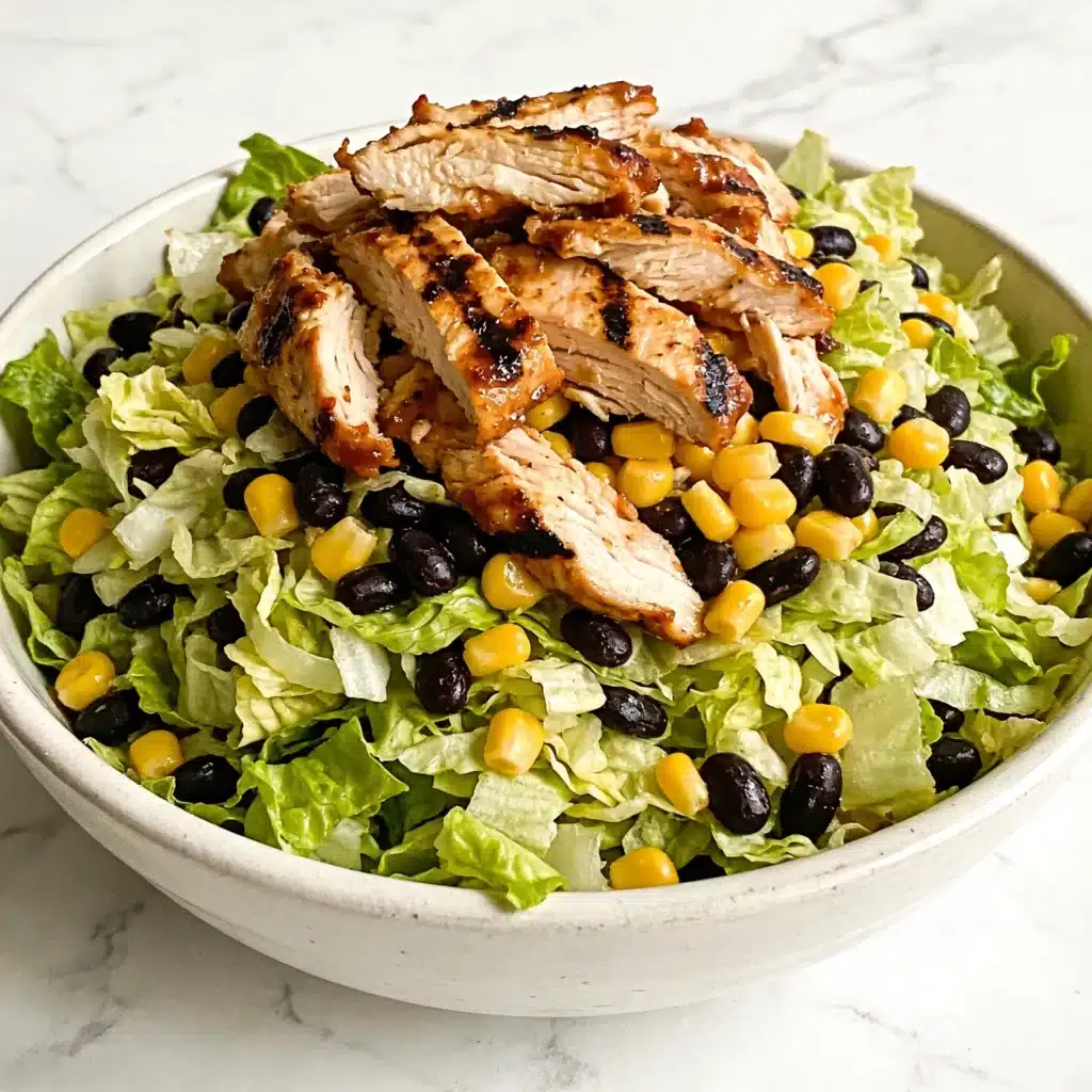 A massive portion of simple low calorie bbq chicken salad showcasing volume eating benefits.