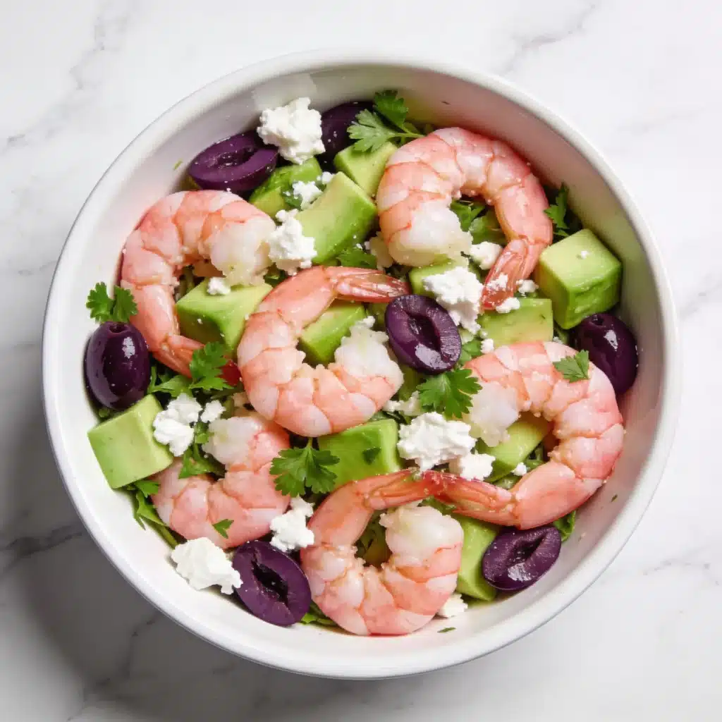 Mediterranean-style shrimp salad with avocado, crumbled feta, and olives.