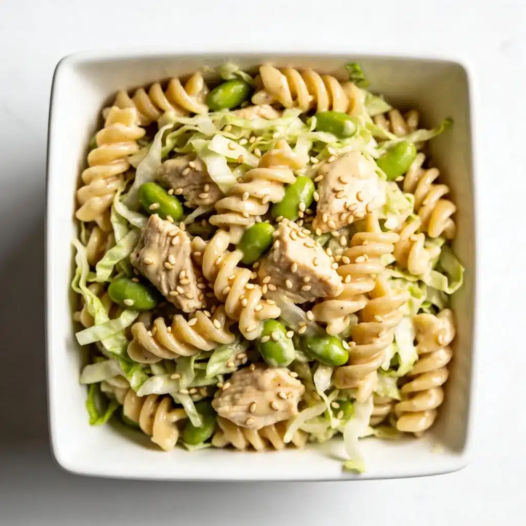 Sesame chicken salad mixed with rotini pasta.