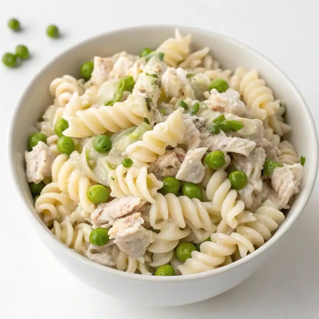 Creamy tuna pasta salad with peas and celery.