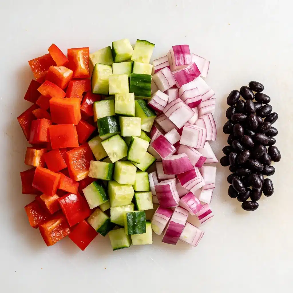 Finely diced peppers and onions matching the size of black beans.