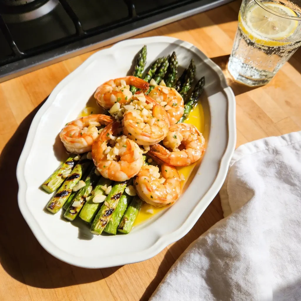 A healthy, anti-inflammatory shrimp dinner served on a sunlit table.