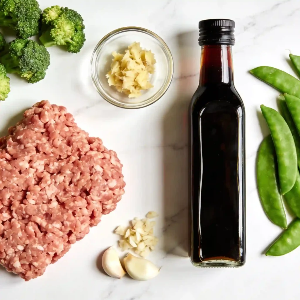 Raw ingredients for making healthy ground turkey stir-fry recipes including lean poultry, fresh ginger, and vibrant vegetables.