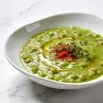 A comforting bowl of healthy split pea soup showcasing its rich, high-fiber, velvety texture.