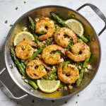A 15-minute zesty shrimp and asparagus skillet garnished with lemon and garlic.